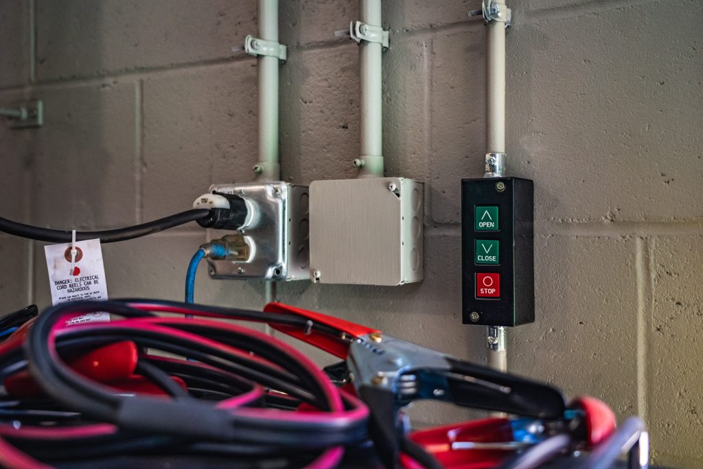 Close-up of electrical switch box and conduit wiring installed by Lupo Electric