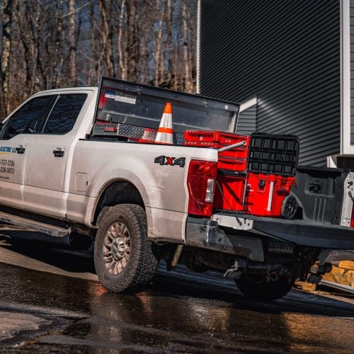 Lupo Electric service truck with tools and equipment parked at residential job site